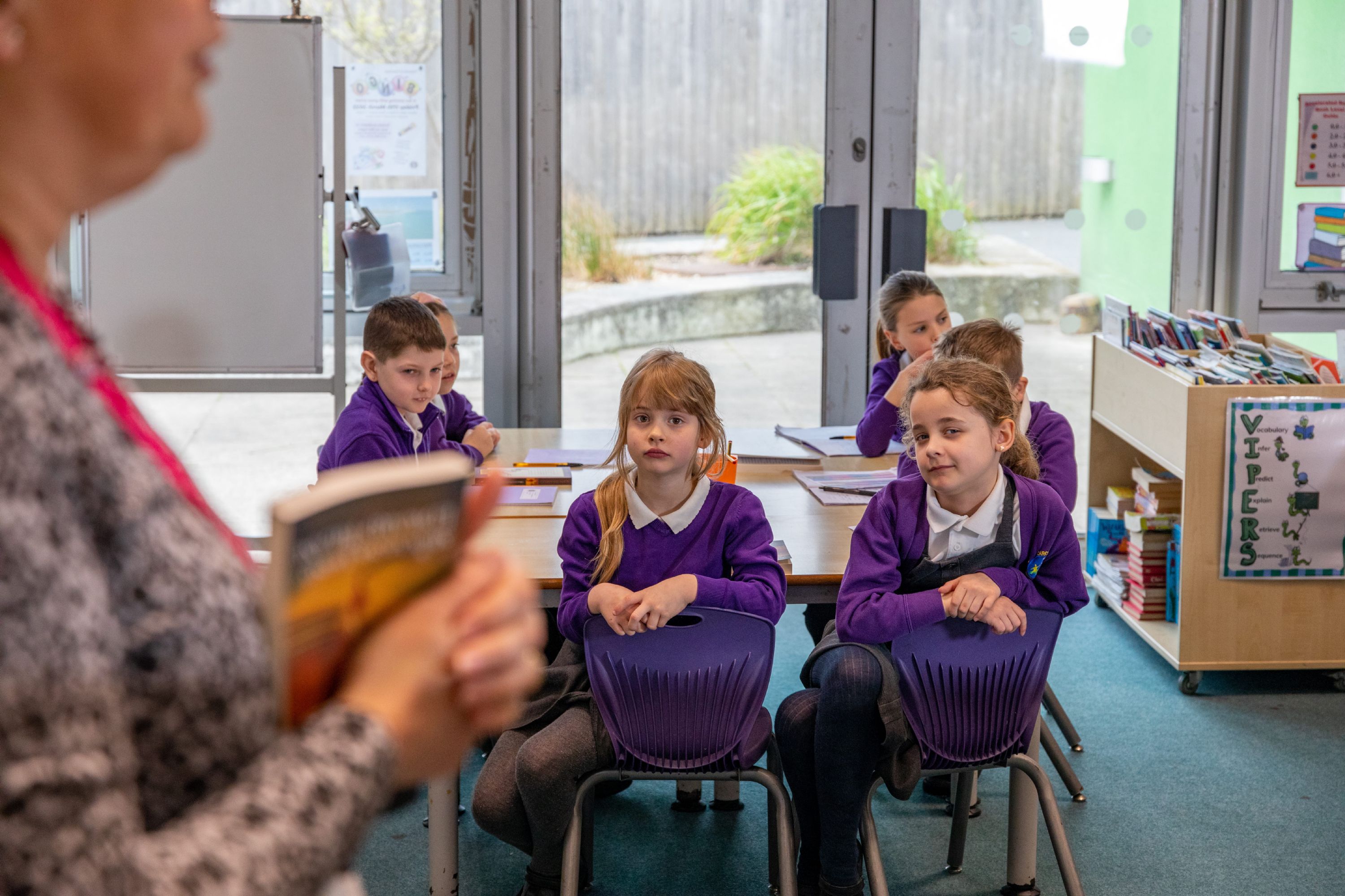 Children listening in class to reading 